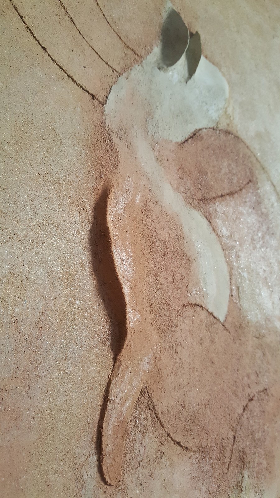 clay earth relief painting of a hybrid siren